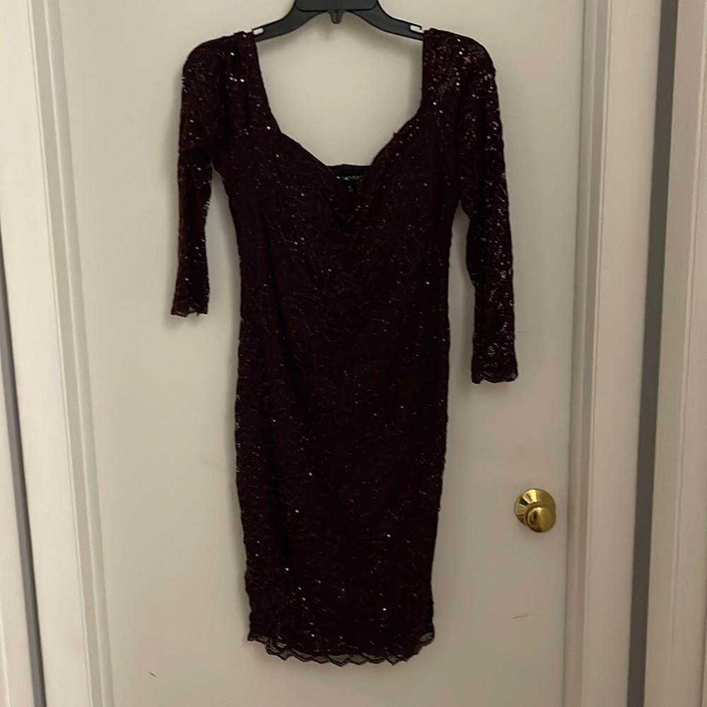 Maroon 3 quarter length sleeve dress. Dress when on is a-little above the knees.